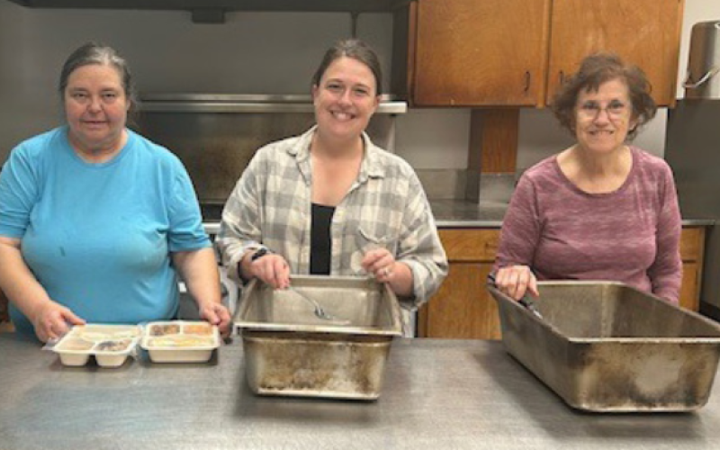 Marla Ebner, Brandy Cunning, and Delores Blaschke prepares meals for senior citizens.