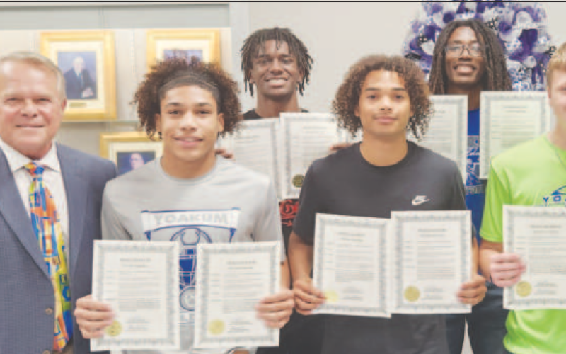 Yoakum Bulldog Track 2024 State Meet Head Bulldog Track Coach Jacoby Jones 4x100-Meter Relay won 1st place (41.81sec new school record): Trae Cuellar, X’Zavier Barnett, Zach Taylor, Qyion Williams, and Brayden Neubauer – Alternate. 4x200-Meter Relay won 2nd place (1:27.03 new school record): Trae Cuellar, X’Zavier Barnett, Zach Taylor, Qyion Williams, and Brayden Neubauer – Alternate. 400-Meter Dash: Chase Polk - 9th place (51.40 sec). Overall Team State Champions: Trae Cuellar, X’Zavier Barnett