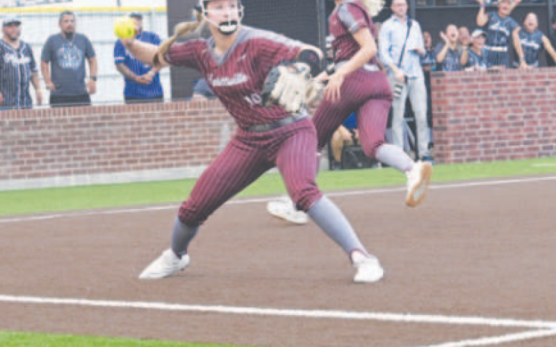 Kaylie Olivarez throws to first after fielding a bunt in Game 1. Chuck Grafe/ Tribune-Herald