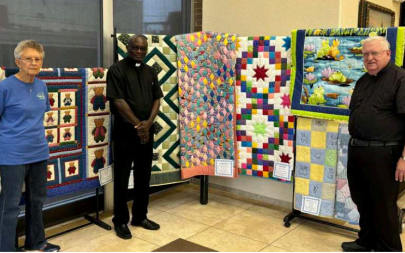 Pictured: Charlene pillow, Fr. John Affum, Monsignor John Peters
