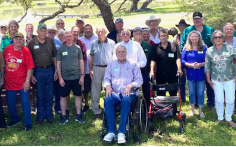 Pictured are members of his teams with Bill. He is the fourth person from the left on the front row. Photo by Darrell Appelt