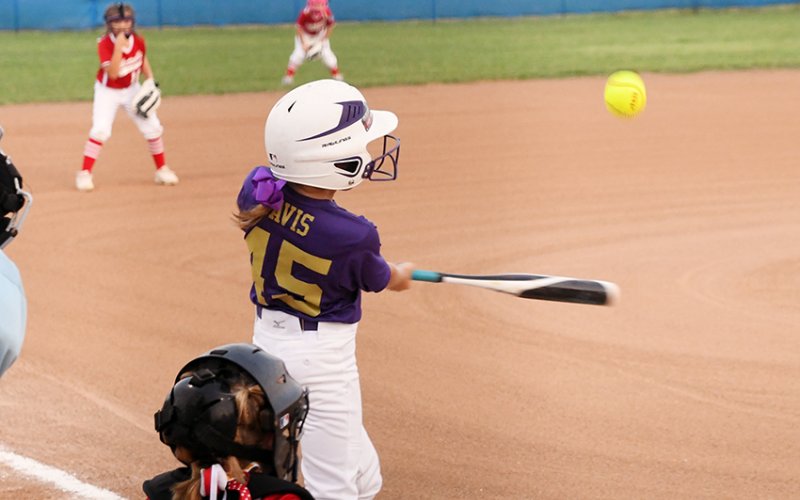 Adella Davis takes a swing during Shiner 8-year-old softball  All-Stars game against Hallettsville on June 3. Photo by Mark Lube.