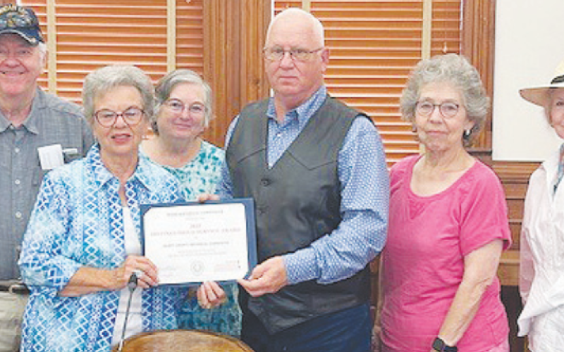 DeWitt County Commissioners present a Distinguished Service Award to the Texas Historical Commission. Pictured from left to right are Texas Historical Commissions member Larry Knuckles, Chairman Peggy Ledbetter, member Barbara Knuckles, Precinct 2 Commissioner James Pilchiek Sr., and members Patricia Muir and Betty Burda.