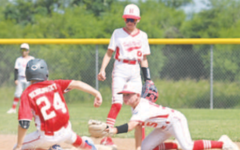 Luke Meinkowsky beats the throw to second during Saturday’s victory. Chuck Grafe/Tribune-Herald