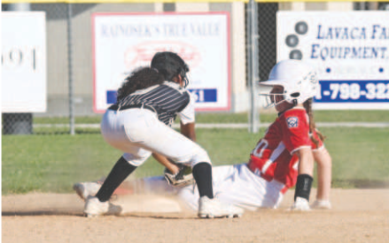 Kasie Davis steals second in the second inning of Sunday’s game. Chuck Grafe/Tribune/Herald