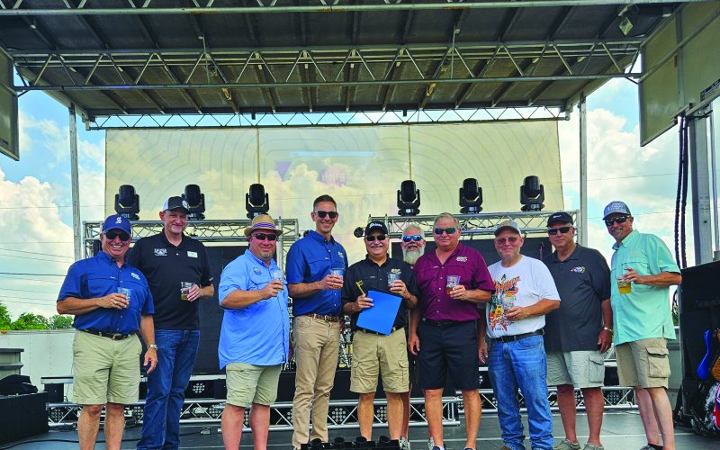 Pictured are, left to right, Tom Fiorenzi (The Gambrinus Company Director of Brewery and Distillery Operations), Egon Barthels (Shiner Chamber of Commerce Board member), Greg Murrile (city councilman), John Brozovich (The Gambrinus Company President and CEO), Jimmy Mauric (retired brewmaster), Brady Brown (city councilman), Greg Hybner (brewmaster), David Schroeder (city councilman), Mayor Fred Hilscher and Troy Cummins (Spoetzl General manager).