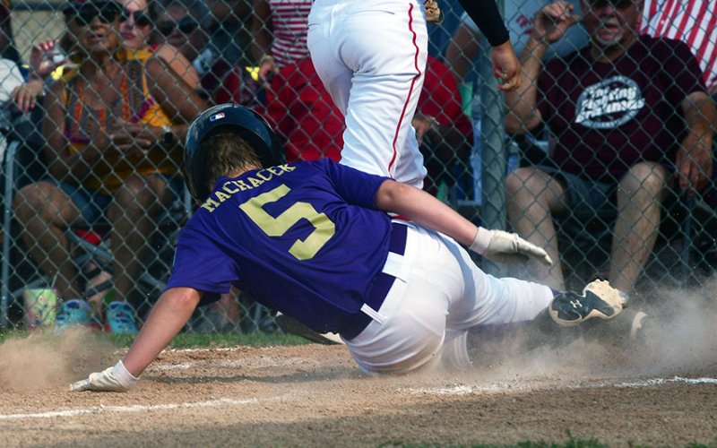 Andrew Machacek scored on a wild pitch in the Shiner Minor baseball team’s 20-5 loss to Hallettsville Red on Sunday. Photo courtesy of Chuck Grafe/Hallettsville Tribune-Herald.