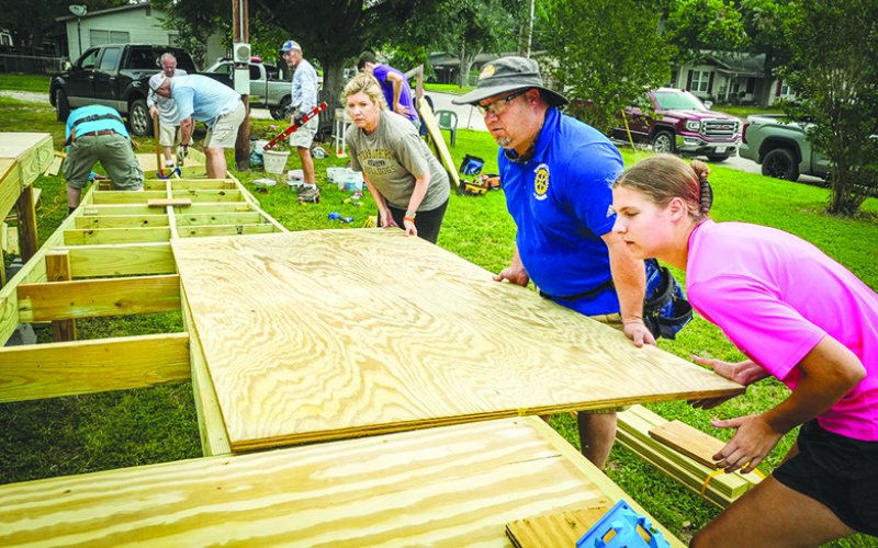 Members of the Shiner Rotary Club, Texas Ramp Project and a few student volunteers work to build a ramp for a local resident. This is the second ramp that the Shiner Rotary has assisted the Texas Ramp Project in building. Volunteers called it a “great fellowship for a great cause.” Pictured in forefront are Melanie Nevlud, Greg Murrile and Kara Remschel.