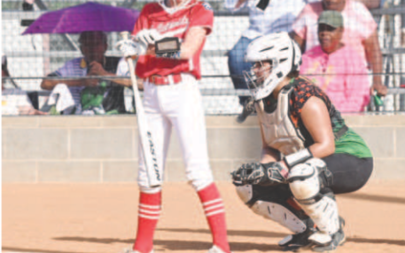 Heidi Grahmann checks her wristband before stepping into the batter’s box. .Chuck Grafe/Tribune-Herald