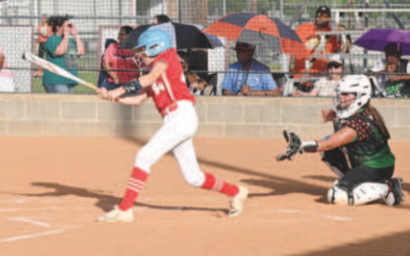 Morgan Felcman puts the ball in play in the July 1 victory of Refugio County. Chuck Grafe/Tribune-Herald