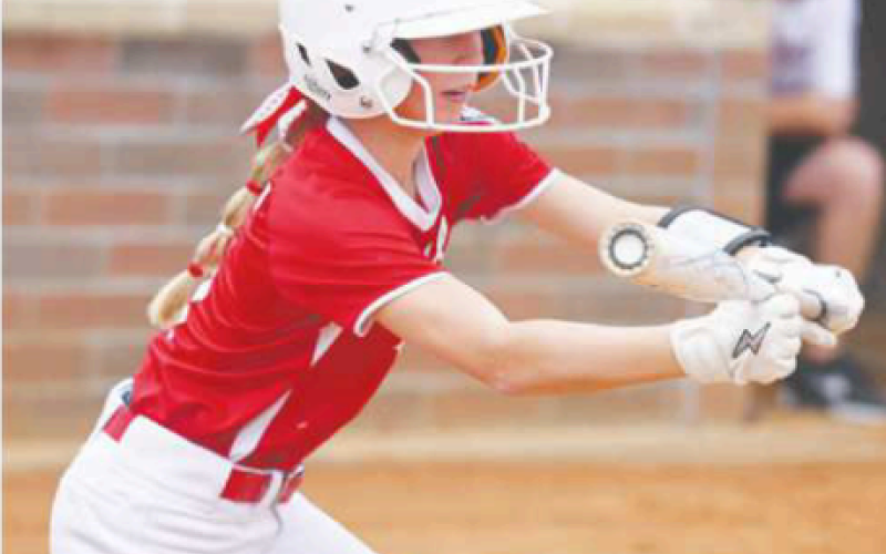 Chloe Grahmann puts down a sacrifice bunt in the Silsbee game. Chuck Grafe/Tribune-Herald