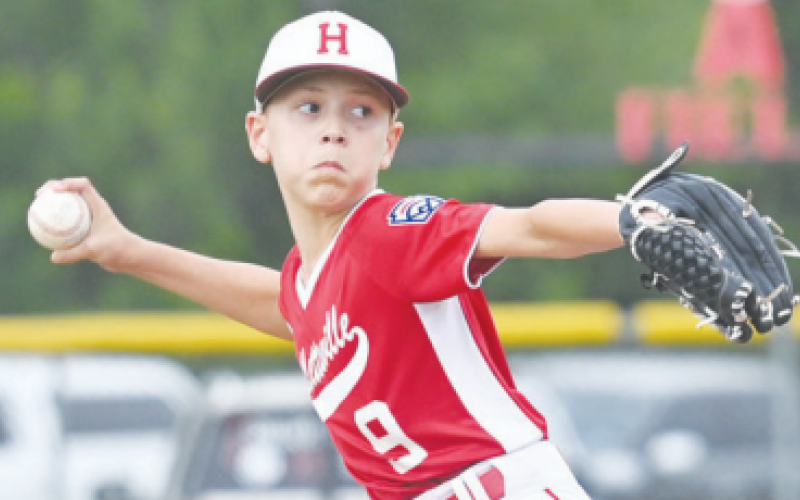 Nash Bucek delivers a pitch against West University. Chuck Grafe/Tribune-Herald