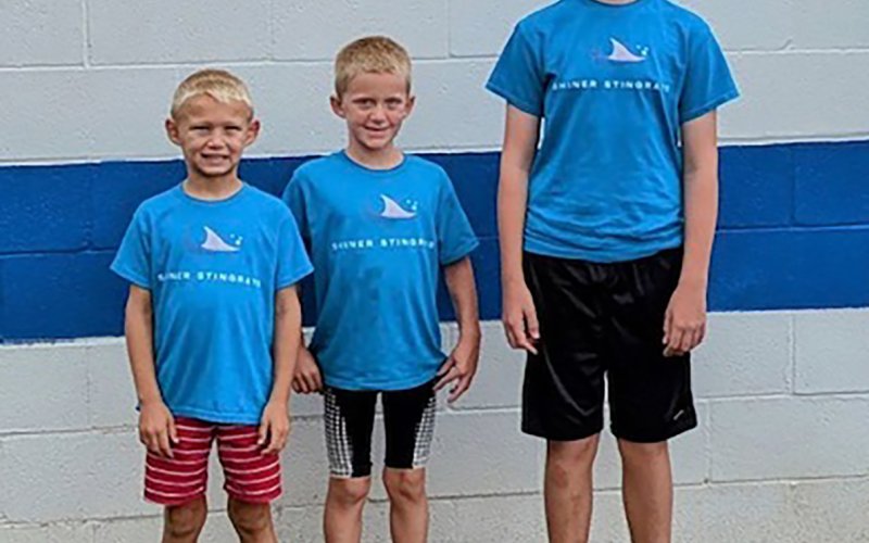 Pictured are State qualifiers Maston Davis, Charlie Park, and Pierce Wallace (left to right). They were the only three of the 23 Shiner Stingray Swim Team members who advanced to State.
