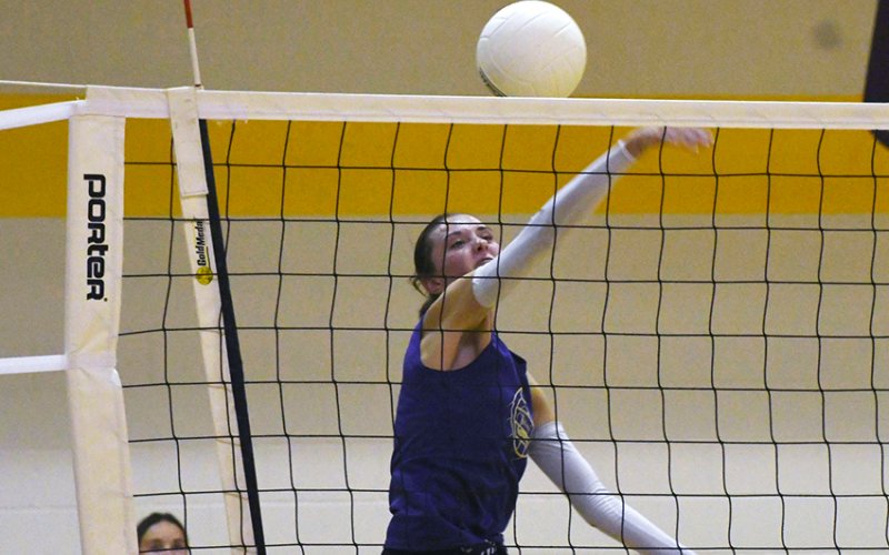 Lady Comanche senior Morgan Lenehan makes a play at the net during volleyball practice on Monday. Photo by Mark Lube.