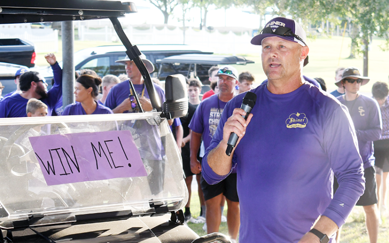 Shiner athletic director and head football coach Daniel Boedeker makes some remarks at the Meet The Comanches event on Monday. Photo by Mark Lube.