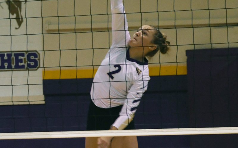 Callie Sevcik makes a kill attempt.Photo by Mark Lube.