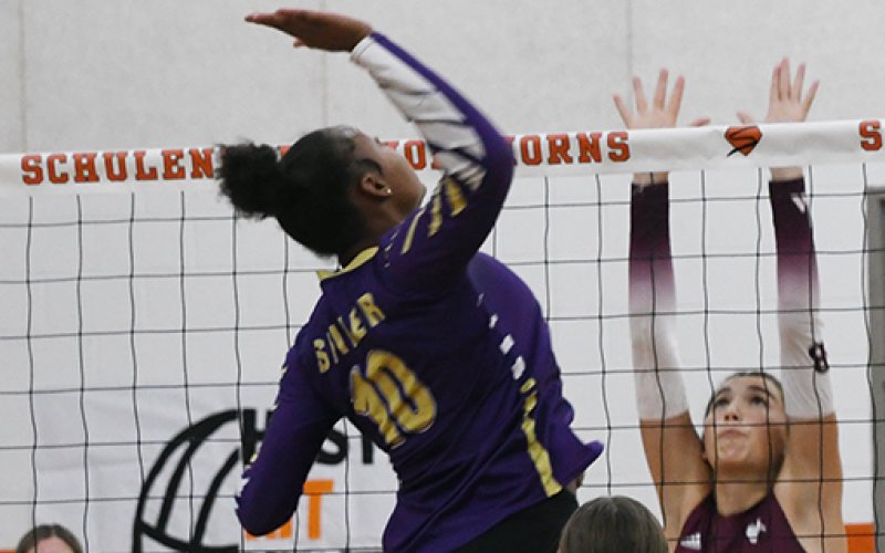 Neveah Jones hops up for a kill attempt against Hallettsville on Thursday in the Schulenburg Tournament. Jones got six kills in the match. Photo by Mark Lube.