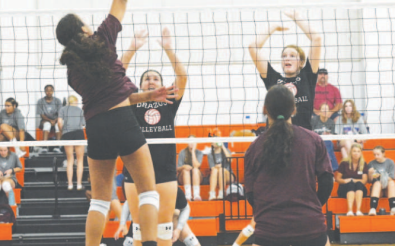 Kasey Harper attacks during the scrimmage in Schulenburg Friday Chuck Grafe/Tribune-Herald
