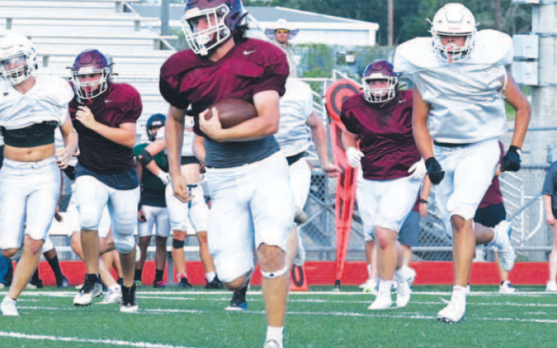 Jesse Cavazos heads up field after catching a pass. Chuck Grafe/Tribune-Herald