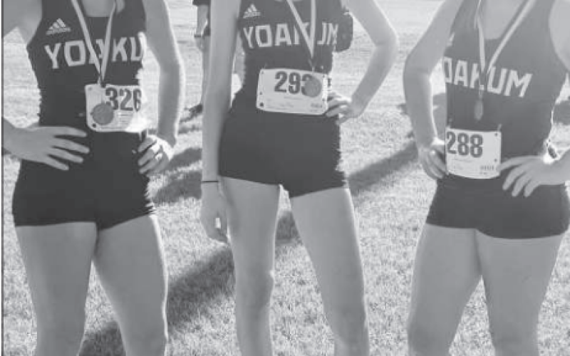 Yoakum Cross Country Lady Bulldogs with medals from meet on Aug. 17. Contributed photo.