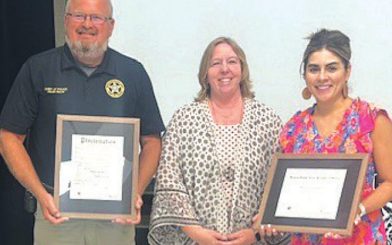 Moulton ISD receives a proclamation designating the school as a Healthy South Texas Campus. Pictured from left to right is school board President Daniel Beyer, County Extension Agent Natalie Knesek, and Elementary School Principal Victoria Ortiz. Photo by Clayton Kelley