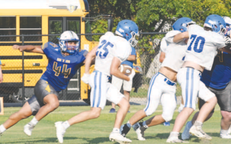 Halfback Cameron Cull carries the mail in Thursday’s scrimmage with Louise. Chuck Grafe/Tribune-Herald