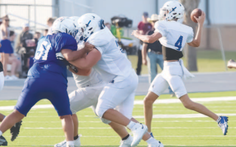 Yoakum High School (YHS) Bulldog back-up quarterback Landry Brown (4) throws a football to a Bulldog receiver during the football scrimmage Aug. 16 in Edna. Photo courtesy of Raymond Rosas.
