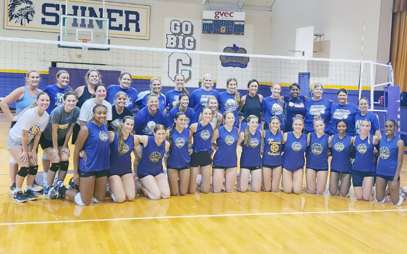 Alumni and current varsity players gather for a group shot after the match. Photo courtesy of Desiree Nitsch.