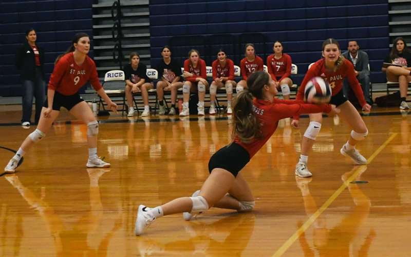 Tatum Walker stretches out for a dig while Samantha Moeller (left) and Skylar Mozisek (right) provide cover in the Rice tournament match against Palacios. Photo by Mark Lube.
