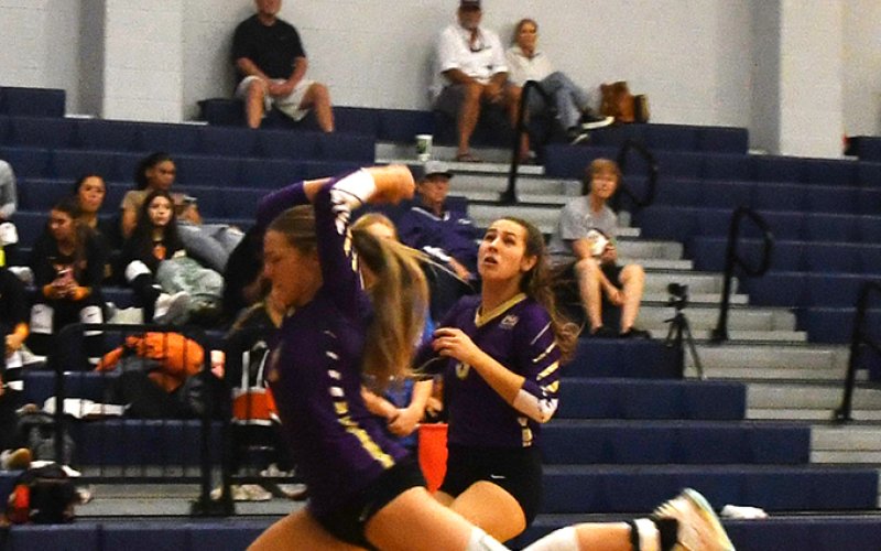 Brinley Ramirez and Chesney Machacek hustle after a ball in the Rice Tournament.  Photo by Mark Lube.