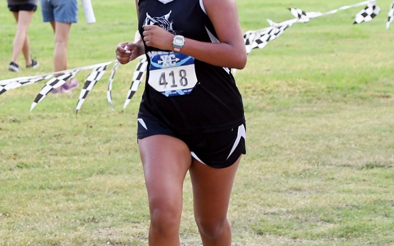 Angelas Juarez runs toward the finish line. She placed No. 49. Photo by Mark Lube.
