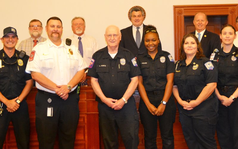 Lavaca County EMT, Lawrence Kurtz was recognized at Monday’s Commissioners’ Court meeting for 47 years of emergency service for the citizens of Lavaca County. In the proclamation approved by the court, it said Kurtz has responded to thousands of emergency calls throughout his career as a emergency technician. Front row, left to right, are Lavaca County EMS members Tim Decker (assistant chief), Michael Furrh (chief), Kurtz, Aiyannia  Adams, Melissa Leopold and Fiona Thomas; back row, left to right, are commi