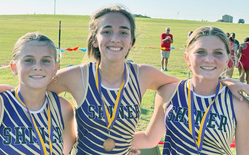 All three Shiner girl runners were top 10 in the 1A-2A varsity race. From left are Jewel Caka, Megan Burns and Jo Caka. Photo courtesy of Michelle Winkenwerder.