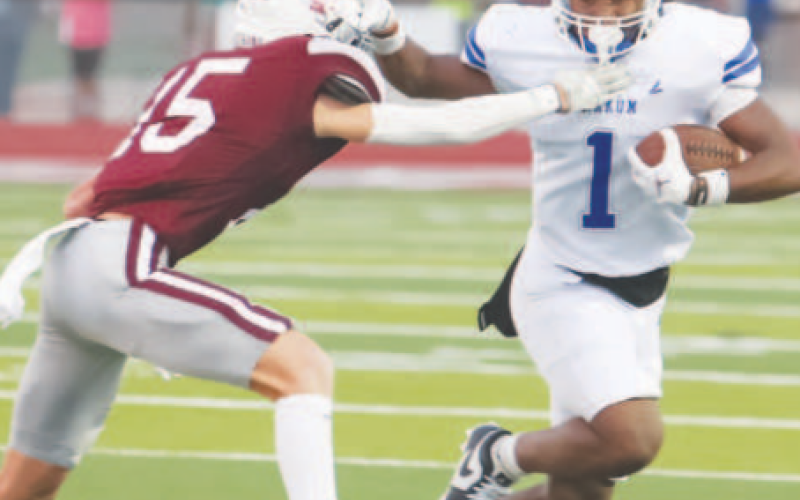 YHS Bulldog Donovan Toussaint (1) runs past an Industrial Cobra defender at the football game Sept. 6. Photo courtesy of Raymond Rosas.