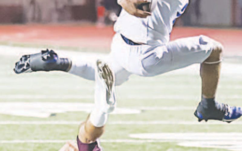 Trae Cuellar leaps over a Columbia High Roughneck football player Sept. 20. Photo courtesy of Raymond Rosas.