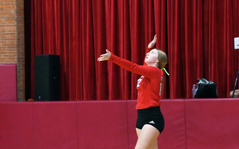 Sloane Kocian serves against Bulverde Bracken on Sept. 26. Photo by Mark Lube.