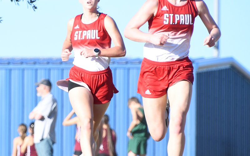 Kristin Cerny (left) and Skylar Mozisek (right), shown here at the Sept. 28 Shiner meet, led the Lady Cardinals XC team to their first state 2A title since 2021 after placing sixth and third, respectively. Photo by Mark Lube.