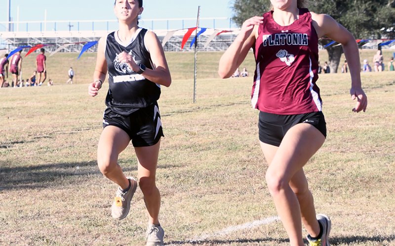 Mina Tinajero battles with a Flatonia runner.  Tinajero was No. 12. Photo by Mark Lube.