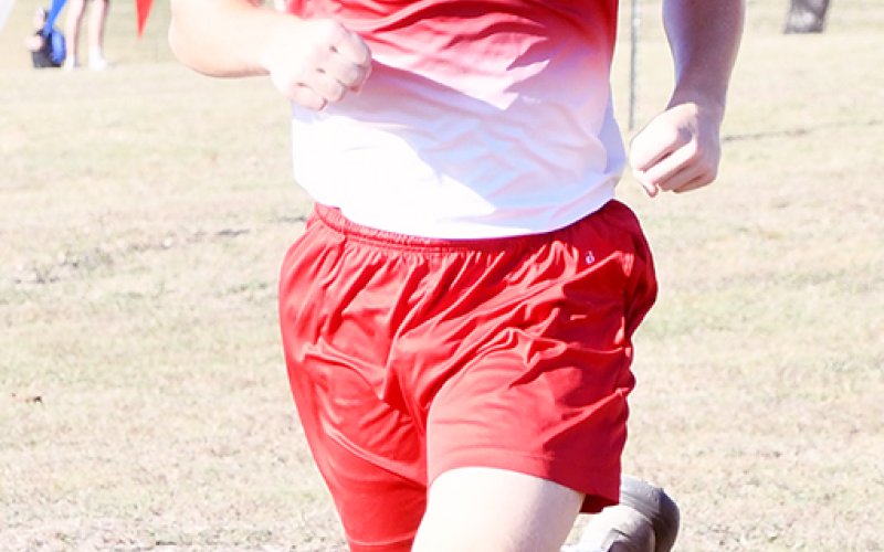 Cardinal runner Carter Chilek runs at the Shiner Sept. 28 meet. Photo by Mark Lube.