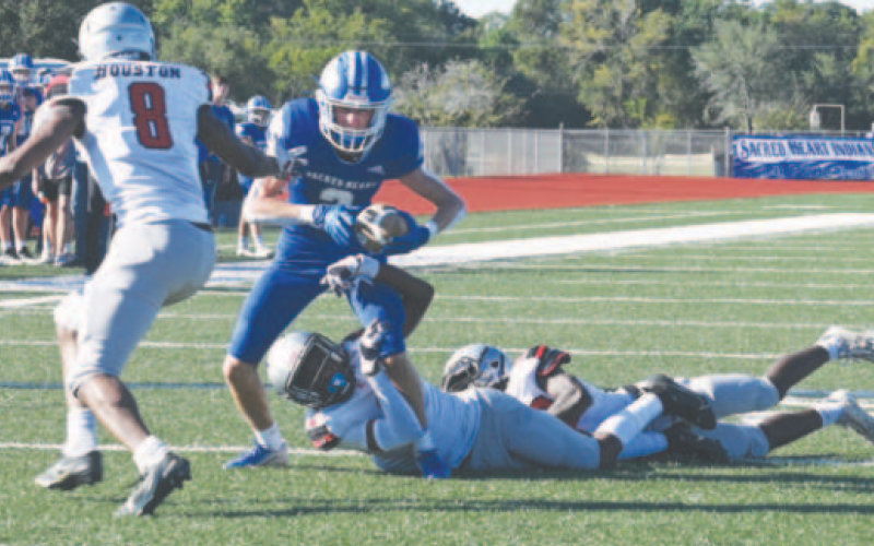 Hudson Kutac carries for a 4-yard gain in the third period. Chuck Grafe/Tribune-Herald