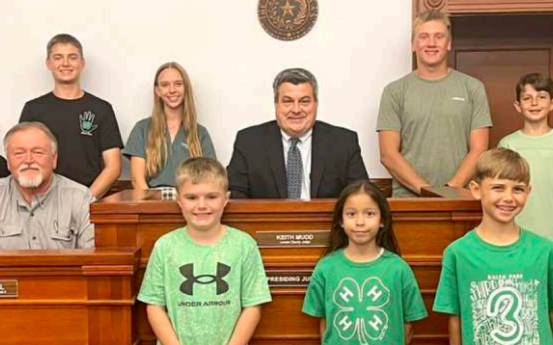 Local Lavaca County 4-H members pose with County Judge Keith Mudd and commissioner Kenny Siegel at the signing of a proclamation designating Oct. 6 through 12 as National 4-H Week. Front from left are Liam Sralla, Breanna Tilton and Caiden Roberts. Middle row from left are Commissioner Siegel and Judge Mudd. Back row from left are 4-H members Emery Haas, Ellasyn Klekar, Ryan Janak, Keely Knesek, Nathan Henke, Jaxson Roberts and Braylee Hanslik. Contributed photo