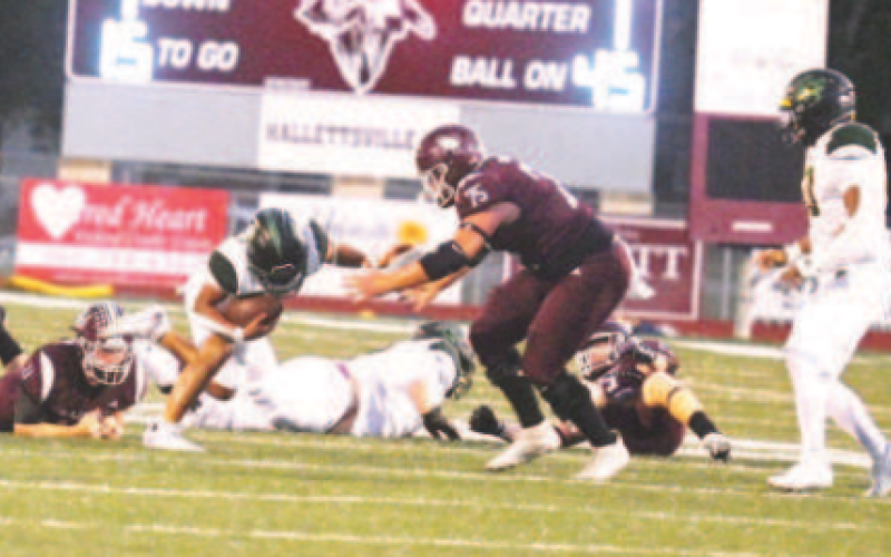 Linebacker Gage Norris (11) trips up Pirate halfback Trevor Garcia. Chuck Grafe/Tribune-Herald