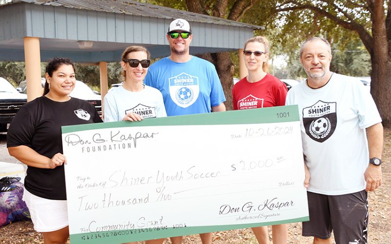 The Don G. Kaspar Foundation donated $2,000 to the Shiner Youth Soccer Association. From left are Agapita Espinosa, Hali Kaspar, Chris Colman, Angela Bays and Gabriel Espinosa. Photo by Mark Lube.
