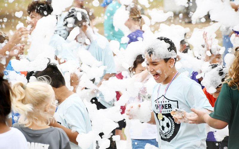 Shiner Youth Soccer Association players enjoyed the foam party at the closing ceremonies for the league on Oct. 26. Photo by Mark Lube.