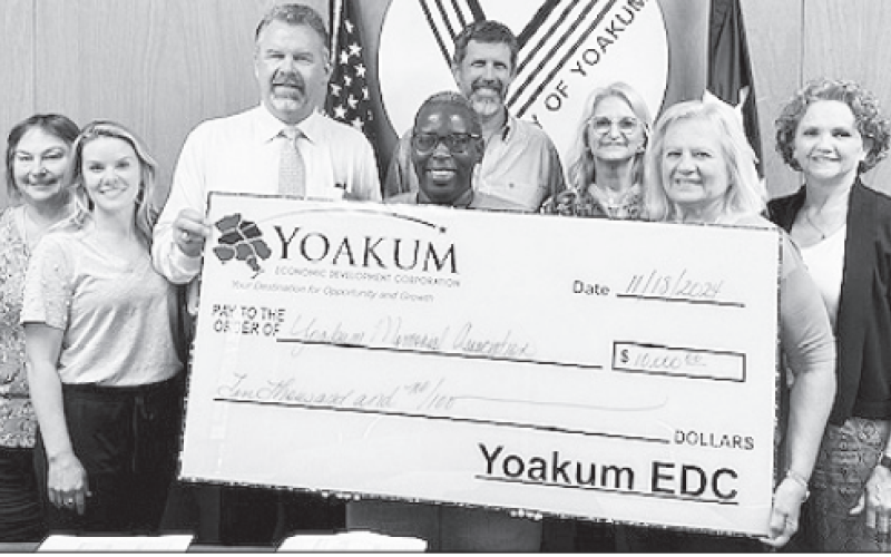 Members of the YEDC board submit a $10,000 check to Vanita Cheeves of the Yoakum Memorial Association. This will go toward new fencing to the Yoakum Colored Cemetery