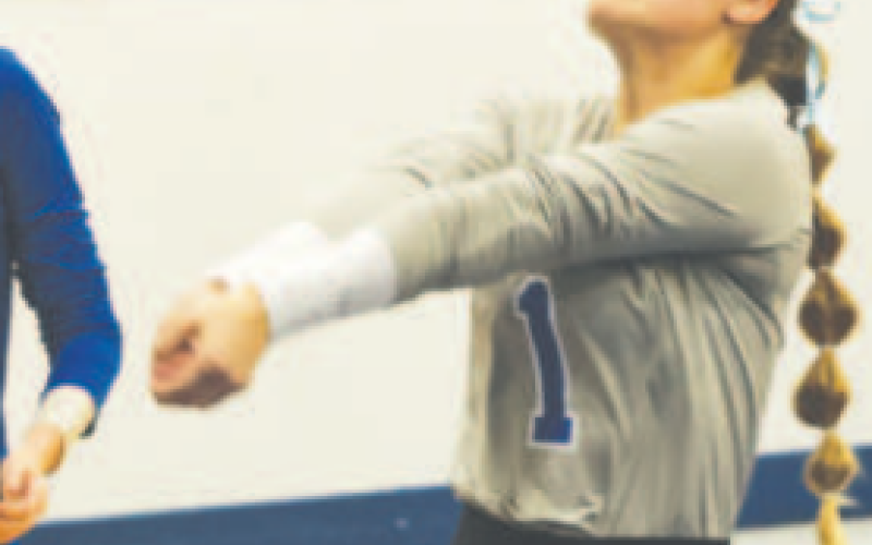 Karley Kostelnik eyes the ball during the bi-district win. Chuck Grafe/Tribune-Herald