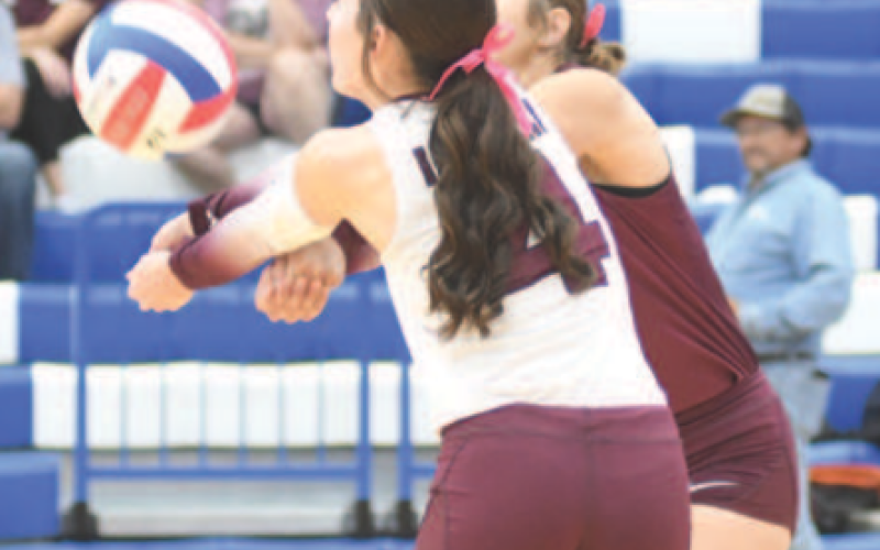 Hanna Zachary, foreground, and Addison Matula converge on the ball. Chuck Grafe/Tribune-Herald