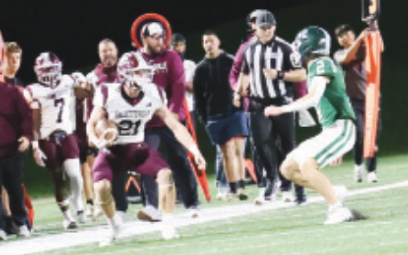 Carter Blaha (16) tries to maneuver around Franklin’s Ryan Smitherman after a pass reception. Chuck Grafe/Tribune-Herald