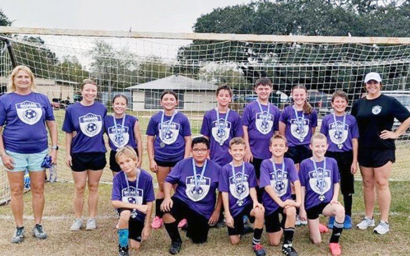 The Shiner U12 got runner up in Hallettsville. Back frow from left are coach Leah Janecek, coach Keri Mikulencak, Andi Mikulencak, Emerson Richter, Raphael Fikac, Casey Rainosek, Avery Colman, Sebastian Kloesel and coach Melissa Colman. Front row from left are Hank Janecek, Ricardo Gonzalez, Bryson Ehrig, Wyatt Decker and Emersyn Kusak. Photo courtesy of Ani Zak/Hallettsville Tribune-Herald.