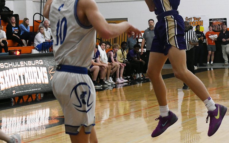 Boe Boehm makes an acrobatic pass against Victoria St. Joseph. Photo by Mark Lube.